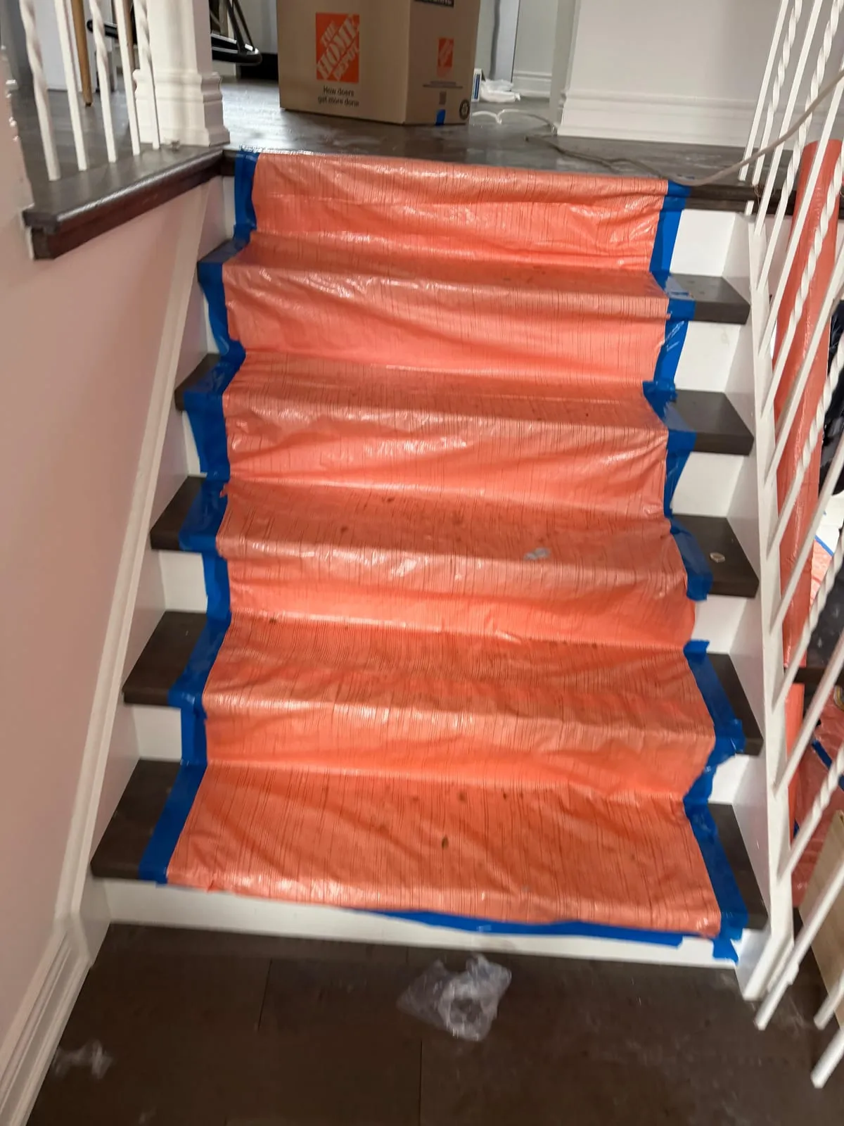Stairs covered with floor protection before work starts